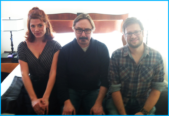 John Hodgman with hosts Vanessa Ragland and Cole Stratton